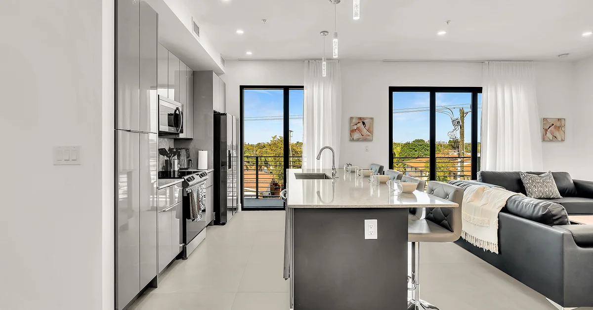 Modern open-plan kitchen and living area with city views in Miami Beach, FL