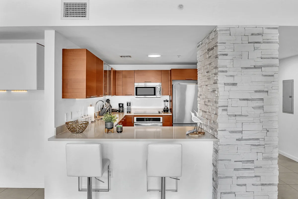 3L Management Group property manager conducting a walkthrough inspection at a Hollywood Beach condo building